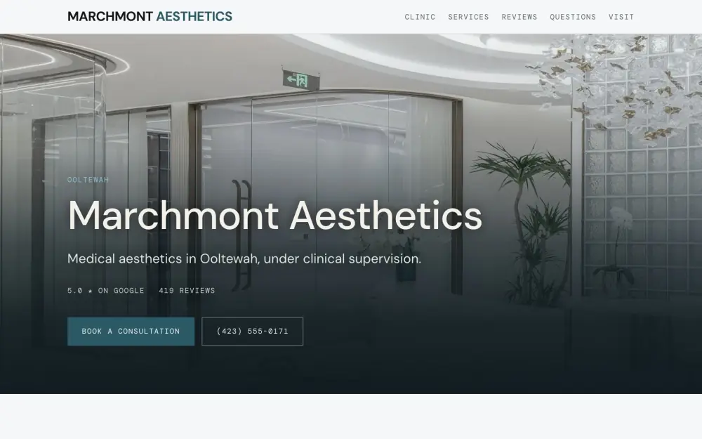 Home page of the Marchmont Aesthetics demo site. A bright reception area with curved white walls and glass partitions.